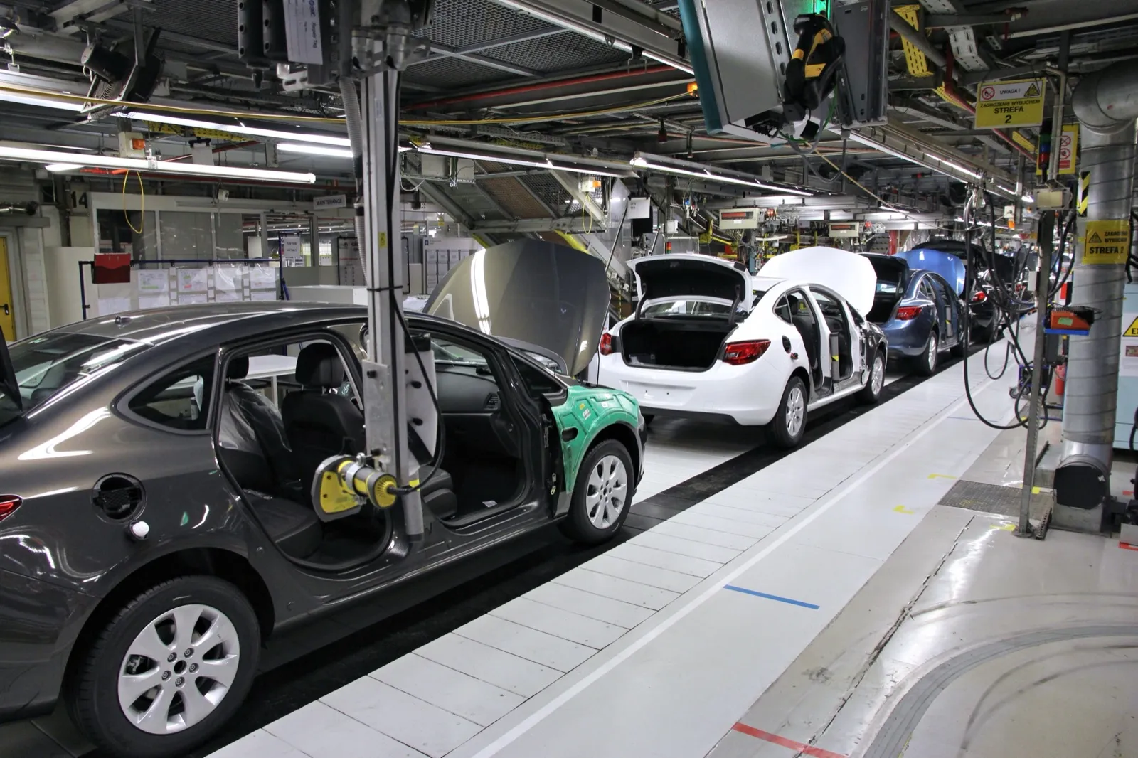 Cars on a factory assembly line